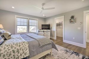 a bedroom with a bed and a flat screen tv at Long Branch Home Less Than 1 Mi to Beach! in Long Branch