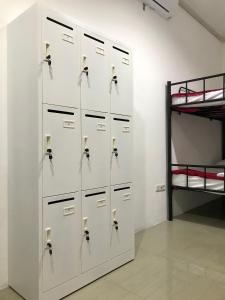 a locker room with lockers and a bunk bed at Yayah Hostel in Bogor