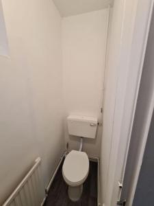 a small bathroom with a white toilet in a room at 6 beds sleeps 8 detached house with private drive in Upper Penn