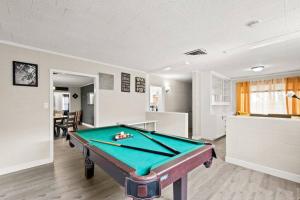 a living room with a pool table in it at Elsie House *great family spot* in Las Vegas