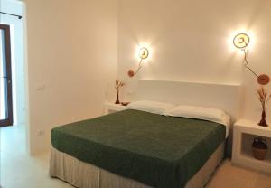 Postel nebo postele na pokoji v ubytování Intornoalnoce suites