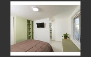 Room in Apartment - Apartment Rodolfo Historic Center TV 또는 엔터테인먼트 센터