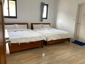 Letto o letti in una camera di Golden Station Homestay