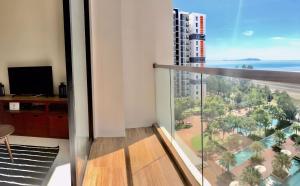an apartment balcony with a view of the ocean at Timurbay by Seascape in Kuantan