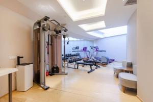 a room with a gym with exercise equipment in it at JI Hotel Beijing West Railway Station South Square in Beijing