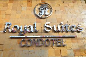 una señal para un restaurante al lado de un edificio en Royal Suites Condotel en Kalibo