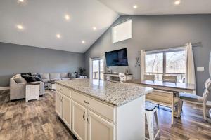 a kitchen and living room with a couch and a table at Waterfront Home on Lake Milton Dock, Hot Tub in Lake Milton