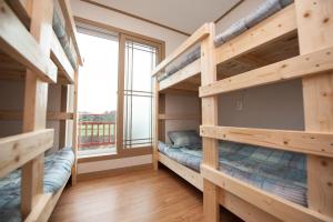 Postel nebo postele na pokoji v ubytování Bangdigareum B&B