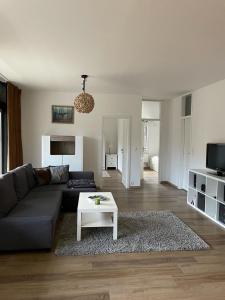 a living room with a couch and a table at Schwalbennest in Bad Harzburg