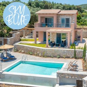 a villa with a swimming pool and a house at 31 Blue Ionian Villas in Apolpaina