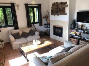 a living room with a couch and a coffee table at Detached house with pool nearby Girona in Sant Julià De Ramis