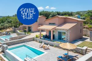 a villa with a swimming pool and a house at 31 Blue Ionian Villas in Apolpaina