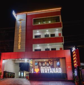 a building with a sign that reads wayland at Rinad Castle Vythiri By Hamra Retreat in Vythiri