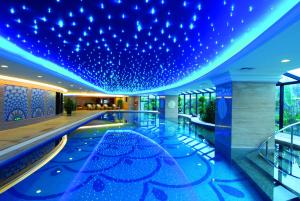 a hotel lobby with blue lights on the ceiling at Kempinski Hotel Shenzhen in Shenzhen