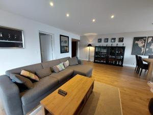a living room with a couch and a coffee table at barbiccaja in Ajaccio
