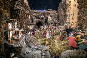 a model of a group of people in a village at LHP Napoli Palace & SPA in Naples