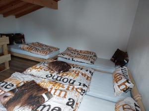 two twin beds in a room with at Gite de Moulin Maurt 1 in Xertigny