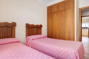 Posteľ alebo postele v izbe v ubytovaní Apartamento El Tajo