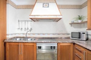 Kuchyňa alebo kuchynka v ubytovaní Apartamento El Tajo