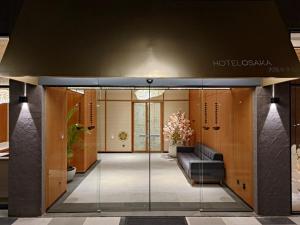 a lobby of a hotel casino with a glass door at Hotel Osaka PIK2 in Tangerang