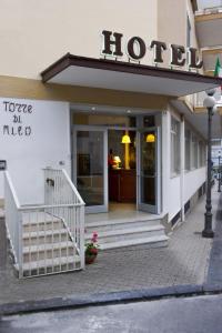 a building with a sign on the front of it at Hotel Torre Di Milo in Maiori