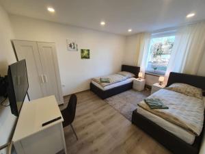 Postel nebo postele na pokoji v ubytování WoHntel Hannover Ricklingen