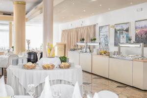 a restaurant with two tables with baskets of food at Villa Arausa in Vodice