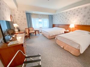 Gulta vai gultas numurā naktsmītnē Evergreen Laurel Hotel - Keelung