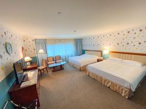 Gulta vai gultas numurā naktsmītnē Evergreen Laurel Hotel - Keelung