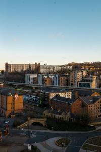 a view of a city with buildings and a street at Apartment @ I Quarter in Sheffield