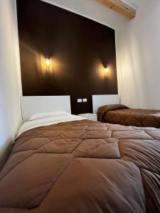 Postel nebo postele na pokoji v ubytování La PortaVecchia - #Home