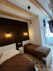 Postel nebo postele na pokoji v ubytování La PortaVecchia - #Home