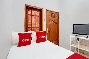 Katil atau katil-katil dalam bilik di OYO Lfie 92310 Banyu Homestay