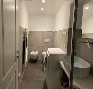 a bathroom with a sink and a toilet at Appartamento al castello di Arco in Arco