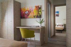 Postel nebo postele na pokoji v ubytování Nido Suite & Apartments