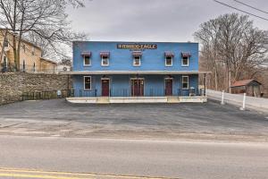 a blue building sitting on the side of a street at Himrod Vacation Rental 3 Mi to Seneca Lake! in Himrod
