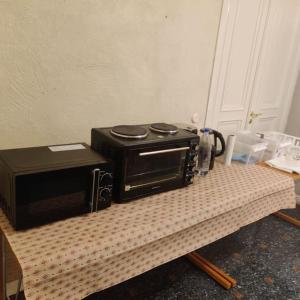 a toaster oven sitting on top of a table at 2 bedroom apartment in Södertälje