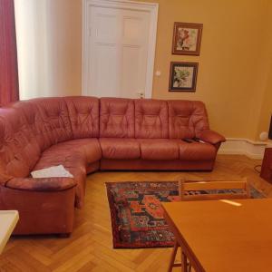 a brown leather couch in a living room at 2 bedroom apartment in Södertälje
