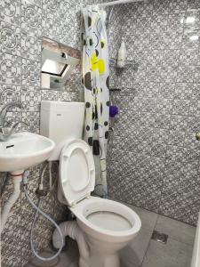 a bathroom with a toilet and a sink at Dar Jacaman - In the heart of Bethlehem old city in Bethlehem +45 photos
