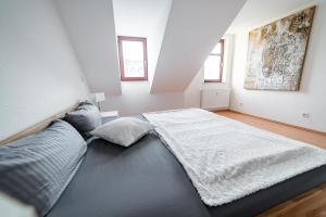 Säng eller sängar i ett rum på FULL HOUSE Studios Chemnitz W110