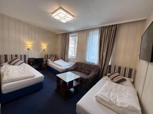 Postel nebo postele na pokoji v ubytování Hotel Austria