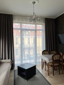 a living room with a couch and a table at Apartment Vilnius Old Town in Vilnius