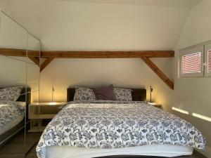 a bedroom with a large bed in a room at Das Herzchen von Ellenz in Ellenz-Poltersdorf