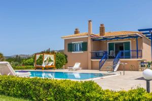 a villa with a swimming pool and a house at Villa Alba Minies in Minia