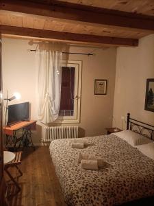 Postel nebo postele na pokoji v ubytování R&B Il Cerchio + 18 fotografií