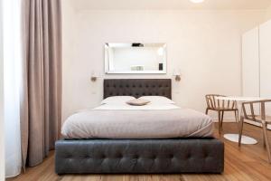 A bed or beds in a room at B&B La finestra sul canale