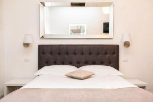 A bed or beds in a room at B&B La finestra sul canale