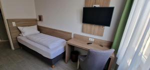 Postel nebo postele na pokoji v ubytování Hotel Ladage