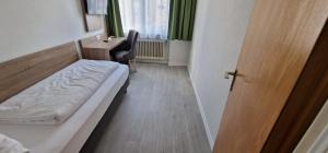 Postel nebo postele na pokoji v ubytování Hotel Ladage