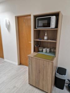 Kuchyň nebo kuchyňský kout v ubytování Hotel Ladage